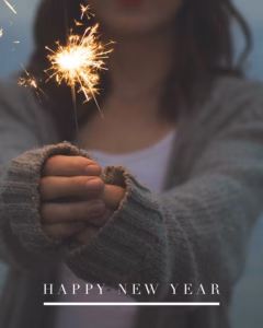 Happy New Year: photo of someone holding a sparkler