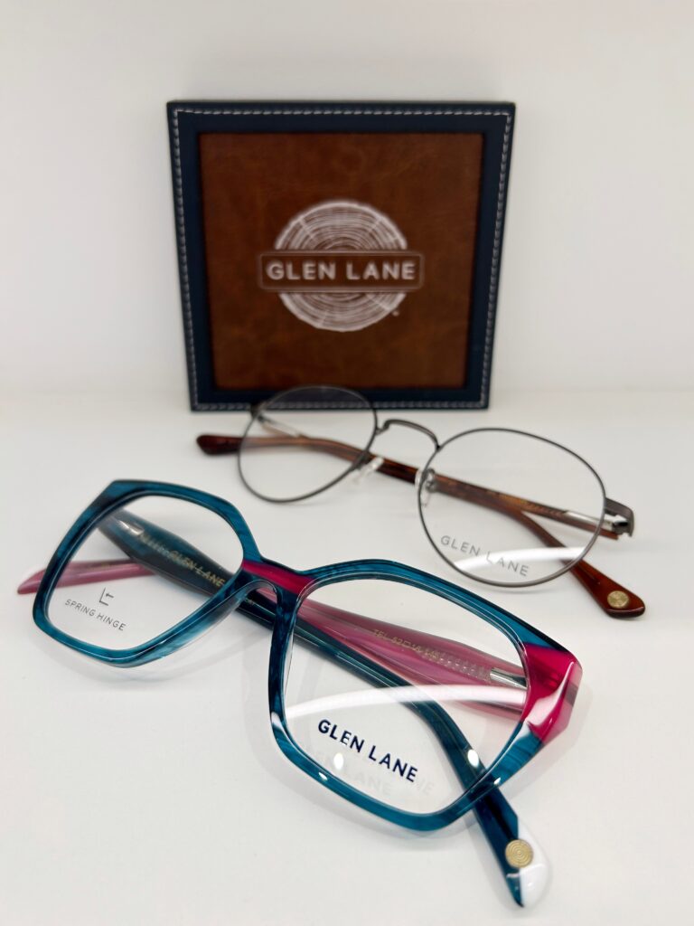 Two Glen Lane frames with logo plaque in the background